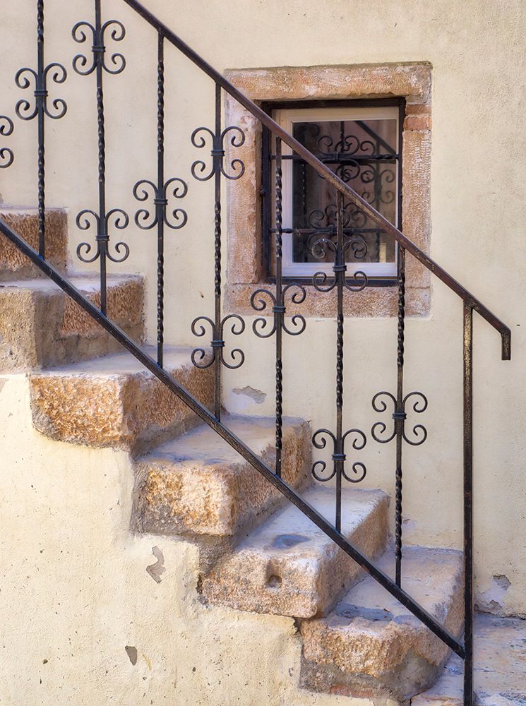 Croatia-Rovinj-Istria. Stairs and wrought iron railing leading to a home.